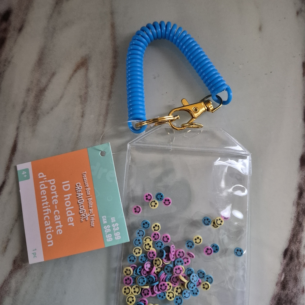 Clear ID Holder with Blue Coil and Colorful Smiley Beads
